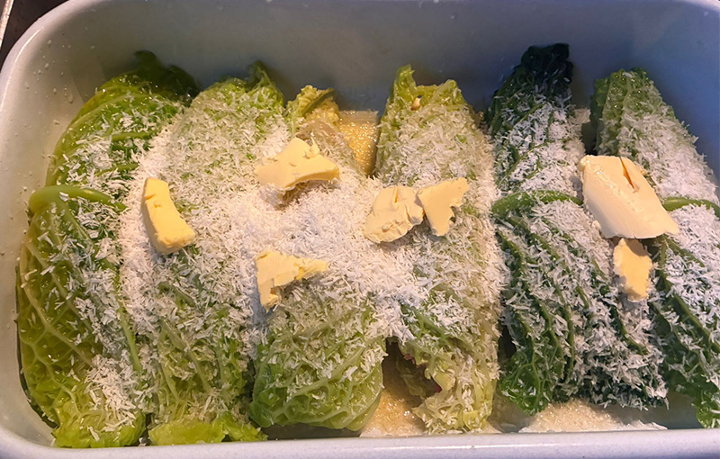 Indonesian cabbage rolls in backing tin with butter